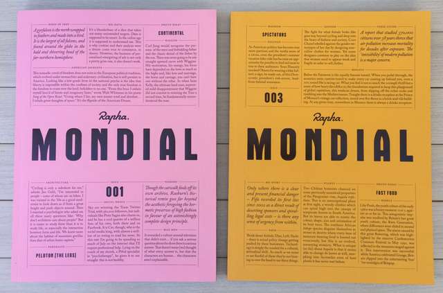 2 issues of Mondial magazine, the left, issue 1, is pink, the right, issue 3, is yellow