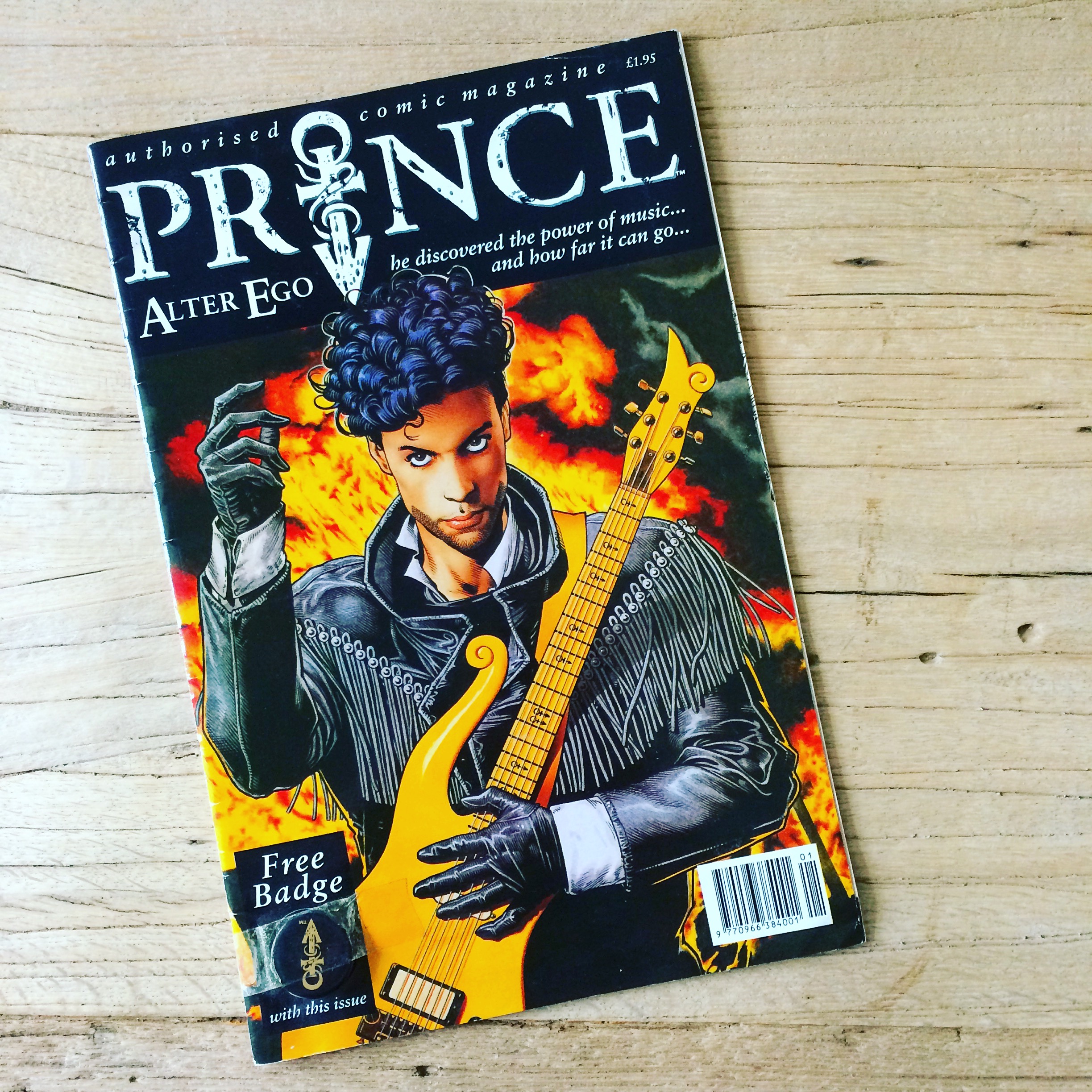 An illustrated Prince comic featuring him on the cover with guitar and flames behind him.