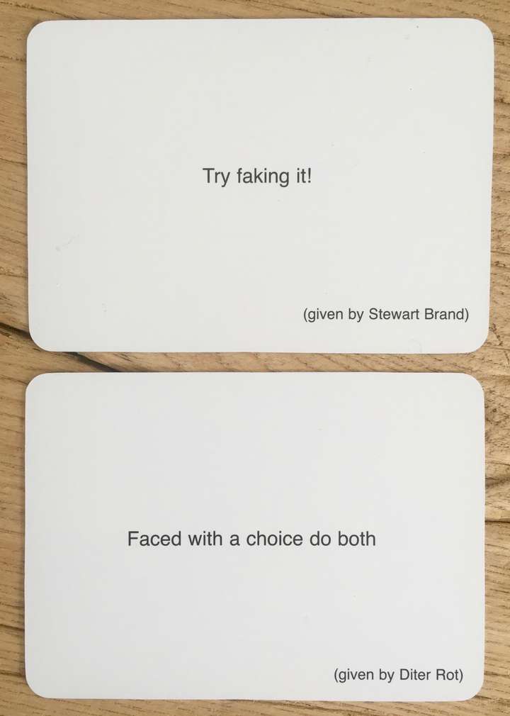 2 cards, car 1 says, Try faking it! (given by Stewart Brand). card 2 says Faced with a choice do both (given by Diter Rot)
