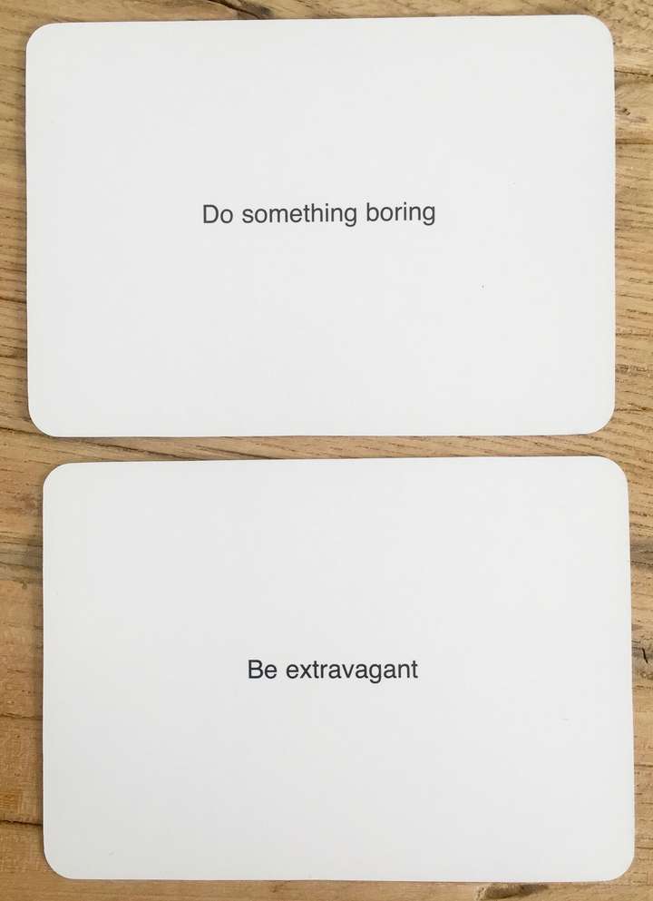 2 cards, car 1 says, Do something boring. card 2 says Be extravagant