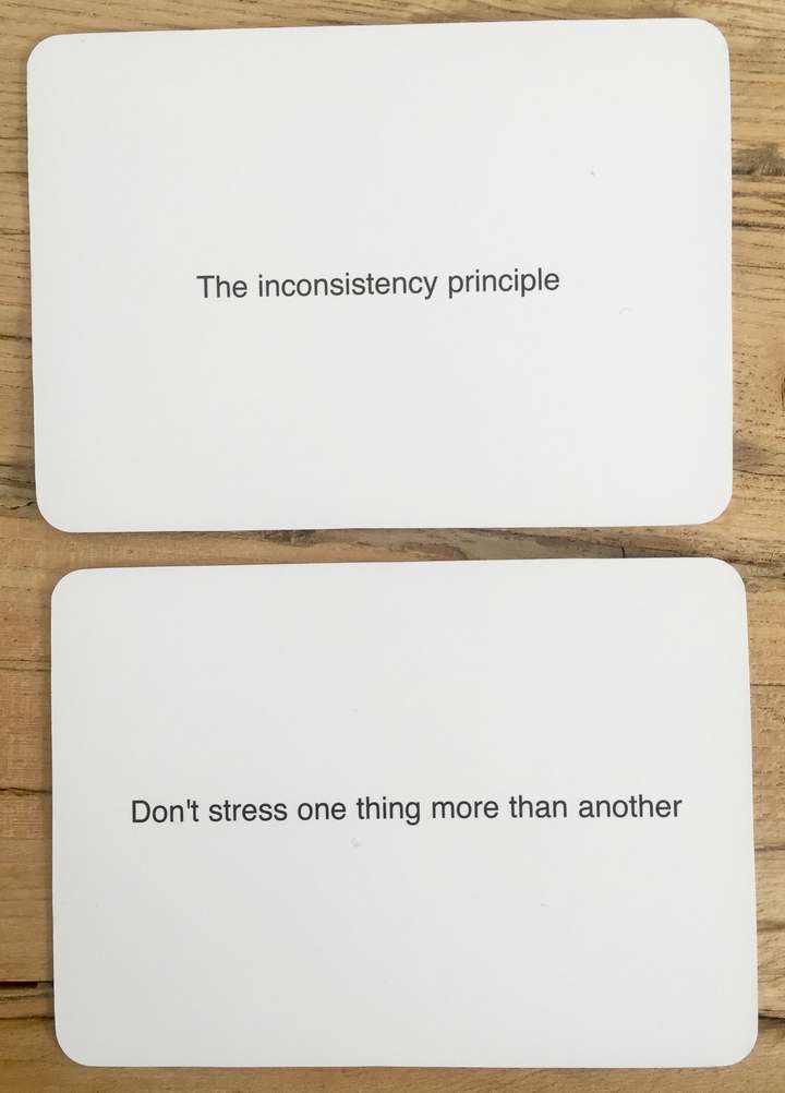 2 cards, car 1 says, The inconsistency principle. card 2 says Don't stress one thing more than another