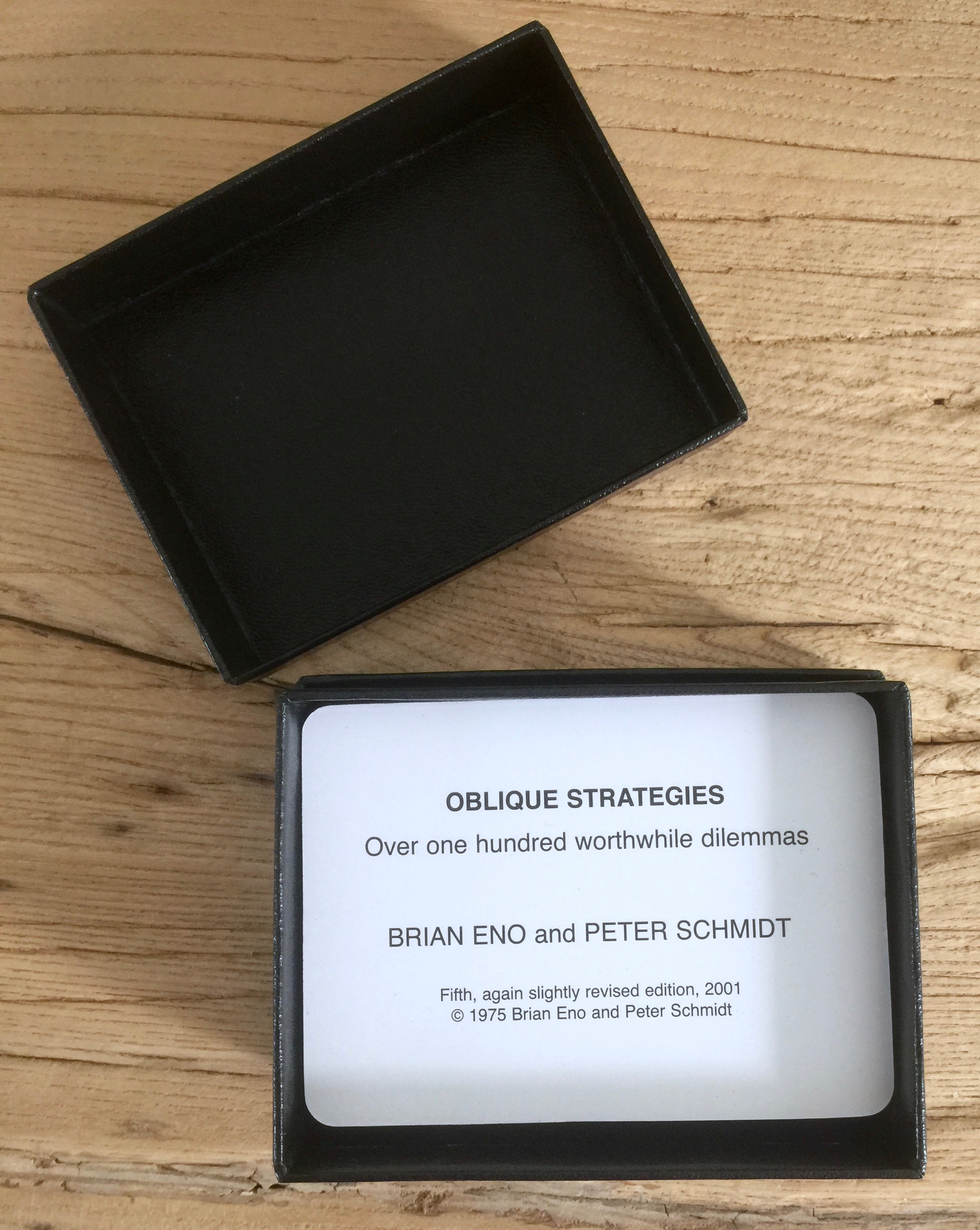 An open box which contains the card set Oblique Strategies