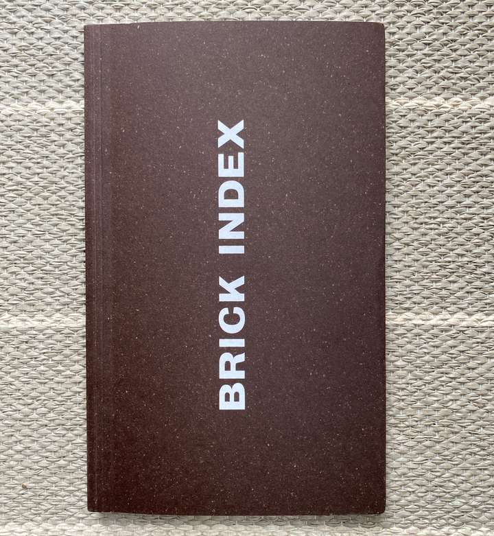 Cover of the book Brick Index, it's a little taller and wider than a standard house brick.