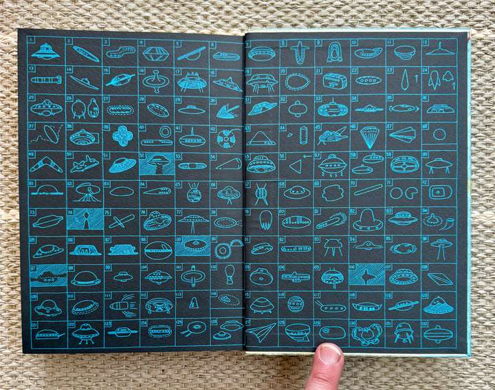Book end papers full of tiny UFO pics