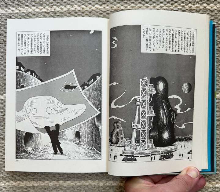 A rocket on a launch pad, but it's a show. A person holding up a massive picture of a UFO
