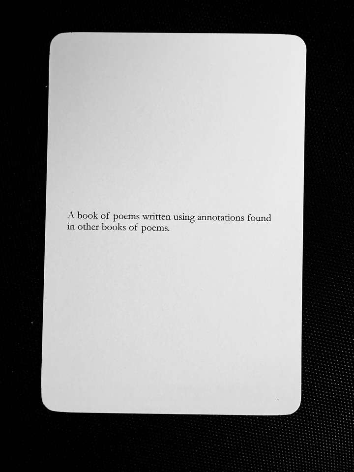 A card saying: A book of poems written using annotations found in other books of poems.