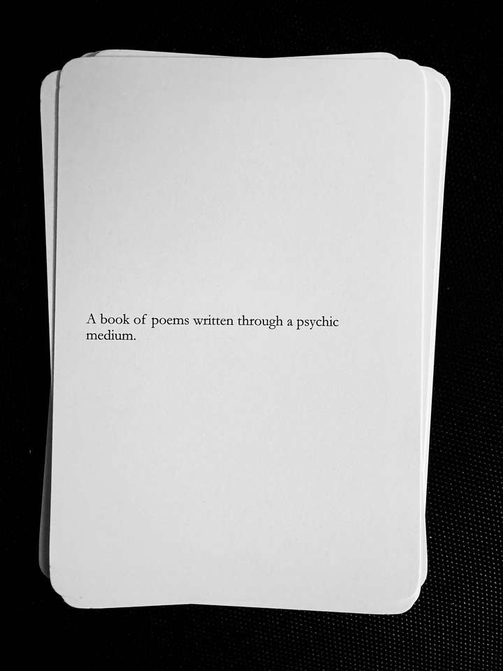 A card saying: A book of poems written through a psychic medium.