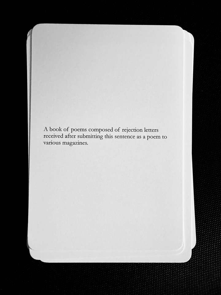 A card saying: A book of poems composed of rejection letters received after submitting this sentence as a poem to various magazines.
