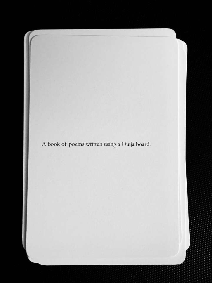 A card saying: A book of poems written using a Ouija board.